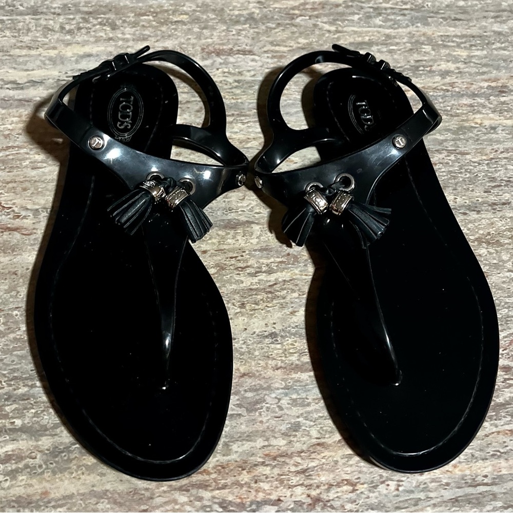 TOD’S thong black rubber strappy sandals with tassels